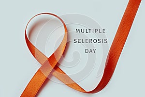 Orange ribbon and text multiple sclerosis day