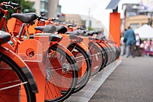 Orange ride sharing bicycles