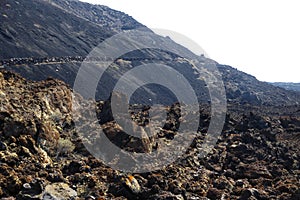Orange rocks and black lava, El Hierro photo