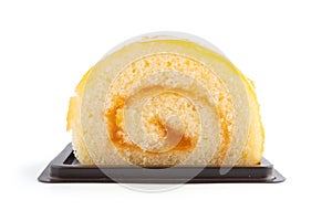 Orange roll cake on white background