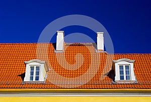 Orange roof against blue sky