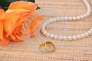Orange Rose with Gold Wedding Rings and Pearls