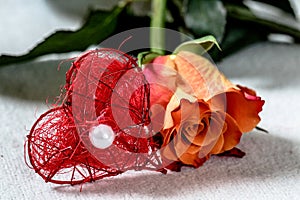 Orange Rose with a red heart an a pearl