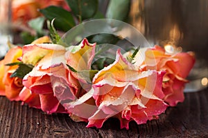 Orange roses on table