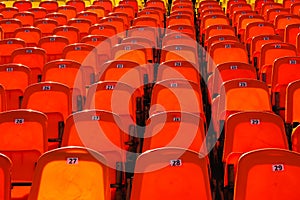 Bright orange rows of seats in the stadium