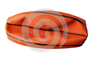 Orange, rubber, deflated basketball ball isolated on white background