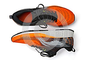 Orange running shoes isolated on white background. Shoes for walking, jogging, running, fitness, physical education
