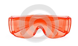 Orange safety glasses on white background photo