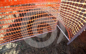 Orange safety net in a road construction site