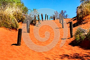 Orange sandy path going uphill in Australian outback