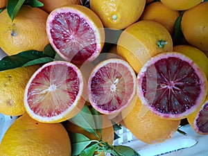 Orange sanguine cut half fresh in greengrocery shop