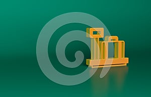 Orange Scale with suitcase icon isolated on green background. Logistic and delivery. Weight of delivery package on a