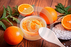 Orange scrub for face or body. Cosmetic product made of natural ingredients.