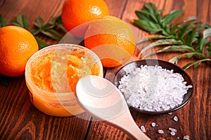 Orange scrub for face or body. Cosmetic product made of natural ingredients.