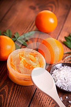 Orange scrub for face or body. Cosmetic product made of natural ingredients.