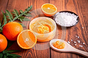 Orange scrub for face or body. Cosmetic product made of natural ingredients.