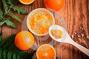 Orange scrub for face or body. Cosmetic product made of natural ingredients.