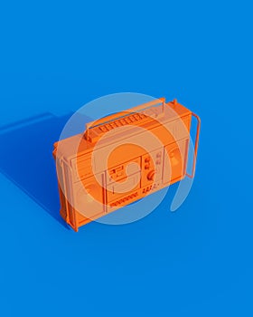 Orange shiny boombox cassette player ghetto blaster sunlight gen z blue background