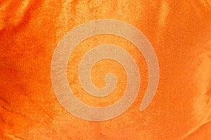Orange shiny velvet texture background photo