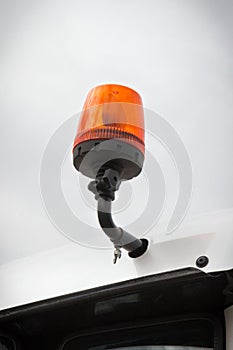 Orange signal lamp on forklift, excavator or other industrial machine. Safety during work. Transportation