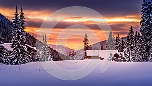 Orange sky sunset over the snow landscape at Sun Peaks Ski Resort