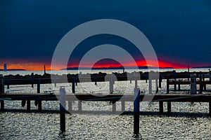 Orange sky under clouds in the winter sunset in Balaton