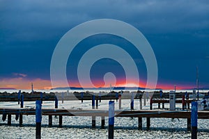 Orange sky under clouds in the winter sunset in Balaton