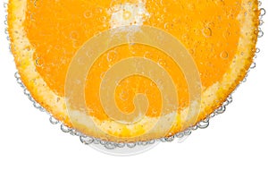 Orange Slice in Clear Fizzy Water Bubble Background