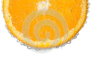 Orange Slice in Clear Fizzy Water Bubble Background photo