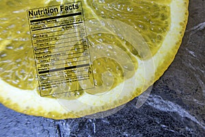 Orange slice with nutrition label on black