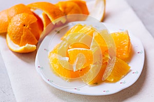 Orange sliced in white plate