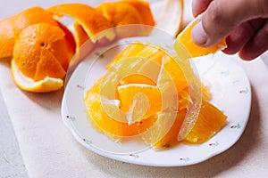 Orange sliced in white plate