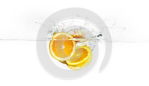 Orange Slices Splashing Water