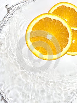 Orange Slices in Water Splashes