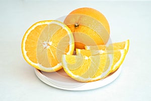 Orange slices on a white plate