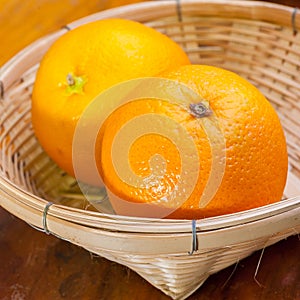 Orange in small basket