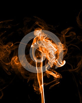 Orange smoke on a black background.