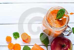 Orange smoothie from carrot and apple.