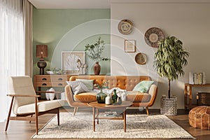 Orange sofa in cozy living room interior with pastel green wall and wood furniture. Wall mockup, 3d rendering