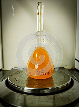 Orange Solution In Pycnometer During Density Test