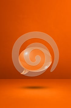 Orange speech bubble on concrete wall vertical background