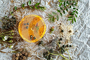 Orange and spices on craft paper