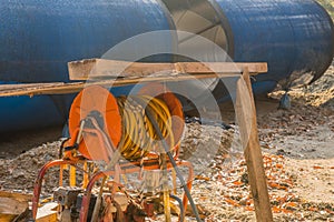 Orange spool of electrical cords