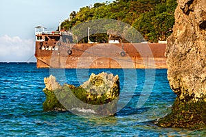 Orange steel pier on tropical sea with rocks Philippines photo