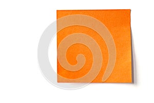Orange sticky note isolated on white photo