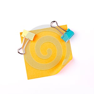 Orange sticky paper note with clips