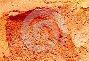 Orange stone as an abstract background. Texture