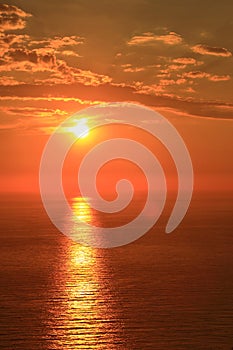 Orange sun with reflection