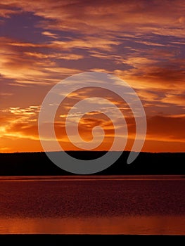 Orange Sunrise on a lake in Colorado