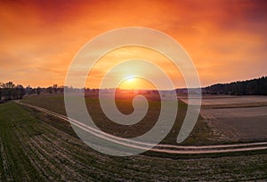 Orange sunset in the countryside. Aerial view